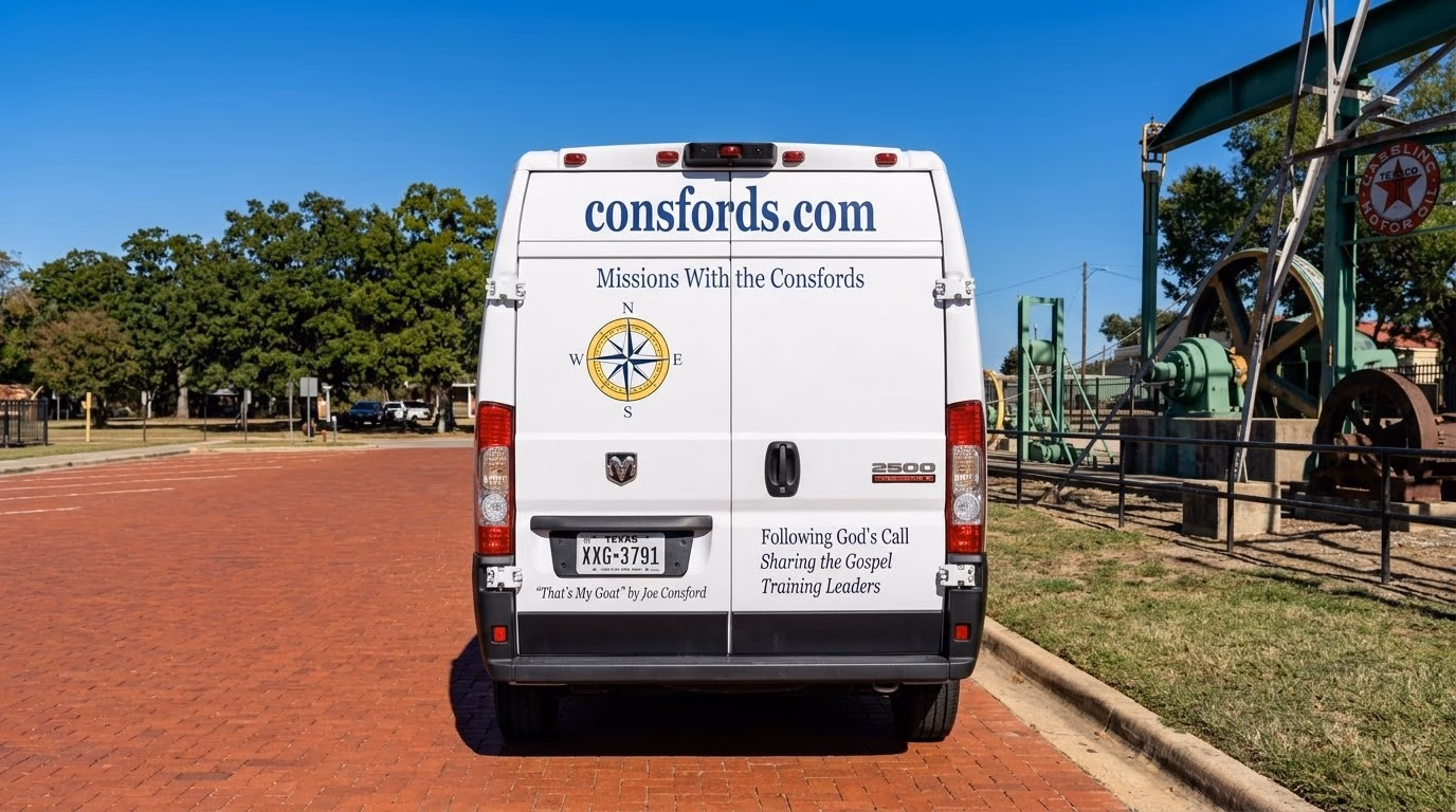 Rear doors of a white van reading consfords.com, Missions With the Consfords, Following God's Call, Sharing the Gospel, Training Leaders